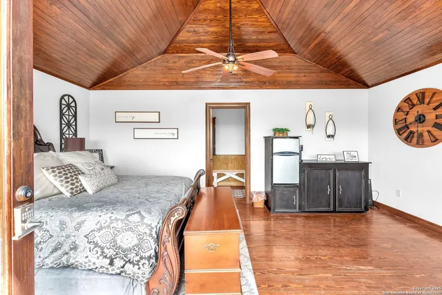 a bedroom with a bed and glass door