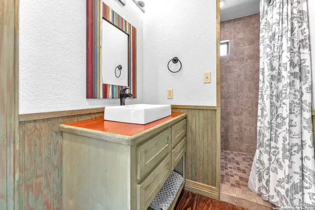 an aerial view of a house with a yard sitting space