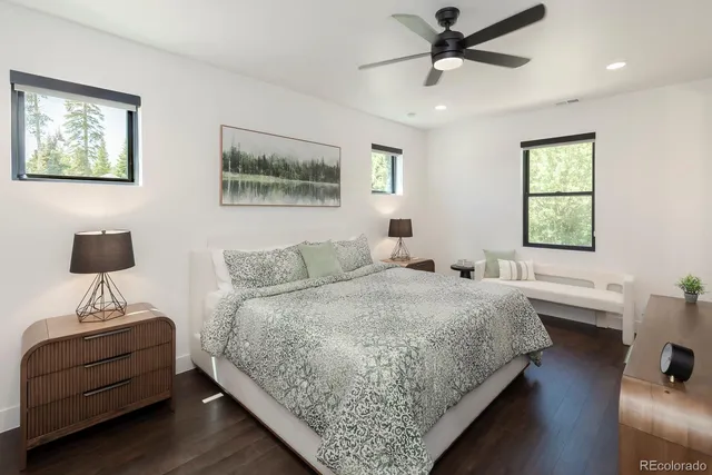 a bedroom with a bed and a desk