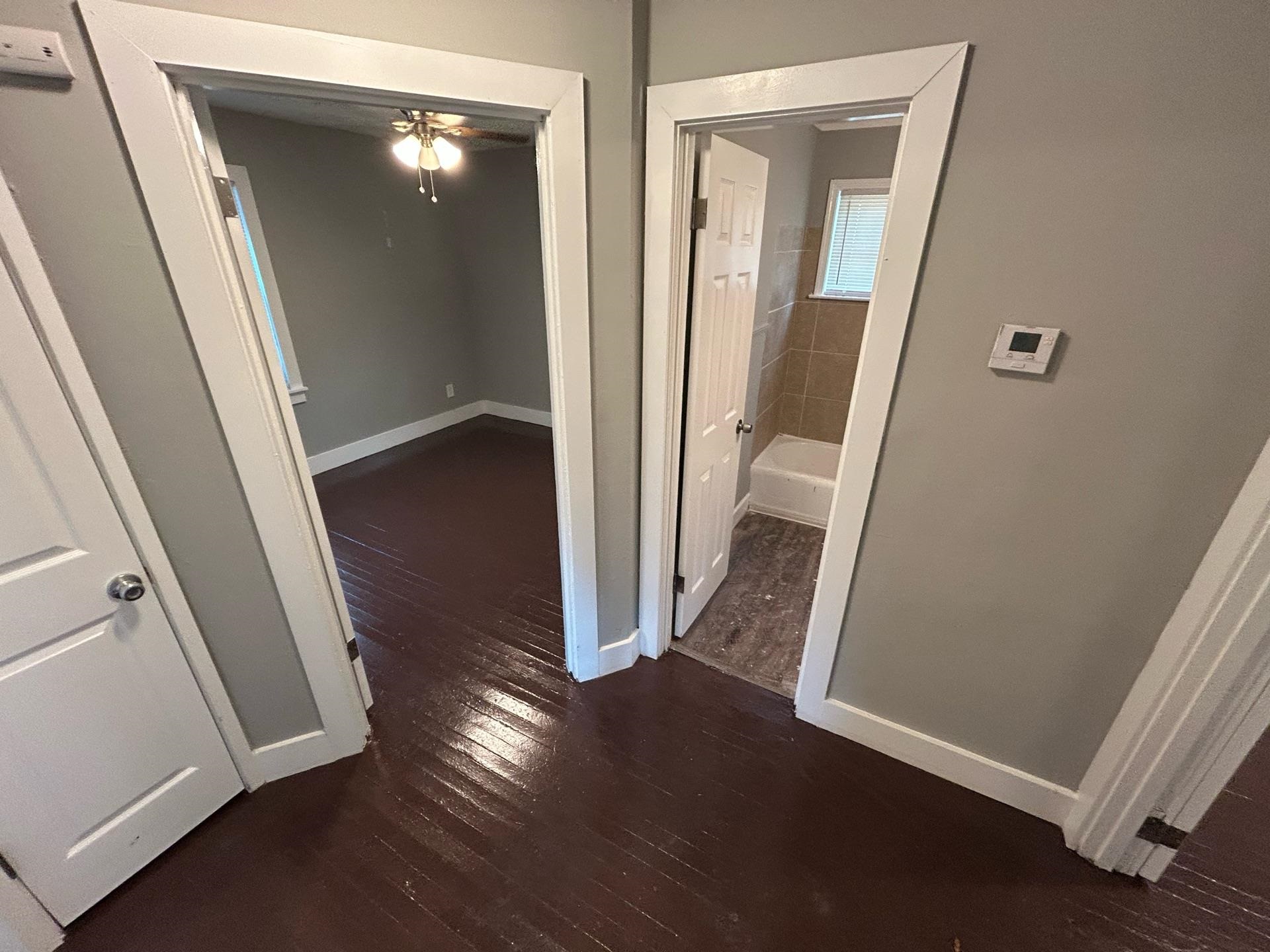 4824 Hodge Road Memphis, TN 38109 - Photo 5 of 6 Hallway featuring dark wood-type flooring