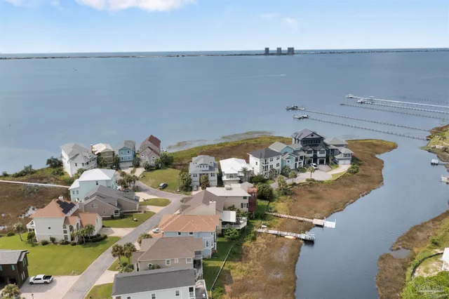 an aerial view of a house with outdoor space lake view