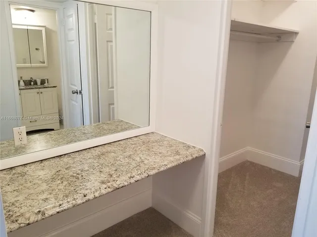 a bedroom with two beds and a window