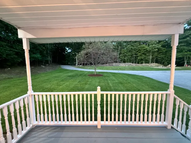 a view of a garden and deck