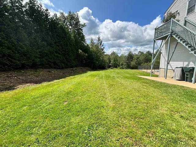 a view of an outdoor space and basketball court