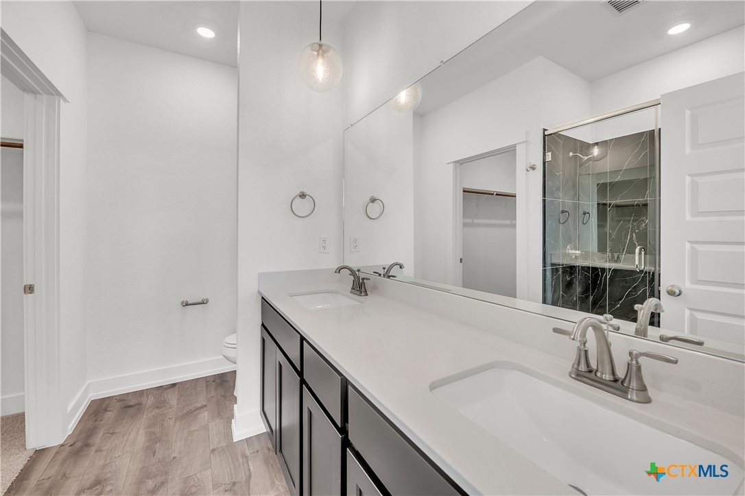1209 Peppermint Drive Temple, TX 76501 - Photo 11 of 17 a bathroom with a sink and a mirror