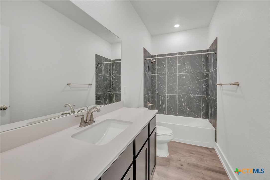 1209 Peppermint Drive Temple, TX 76501 - Photo 15 of 17 a bathroom with a sink toilet and shower