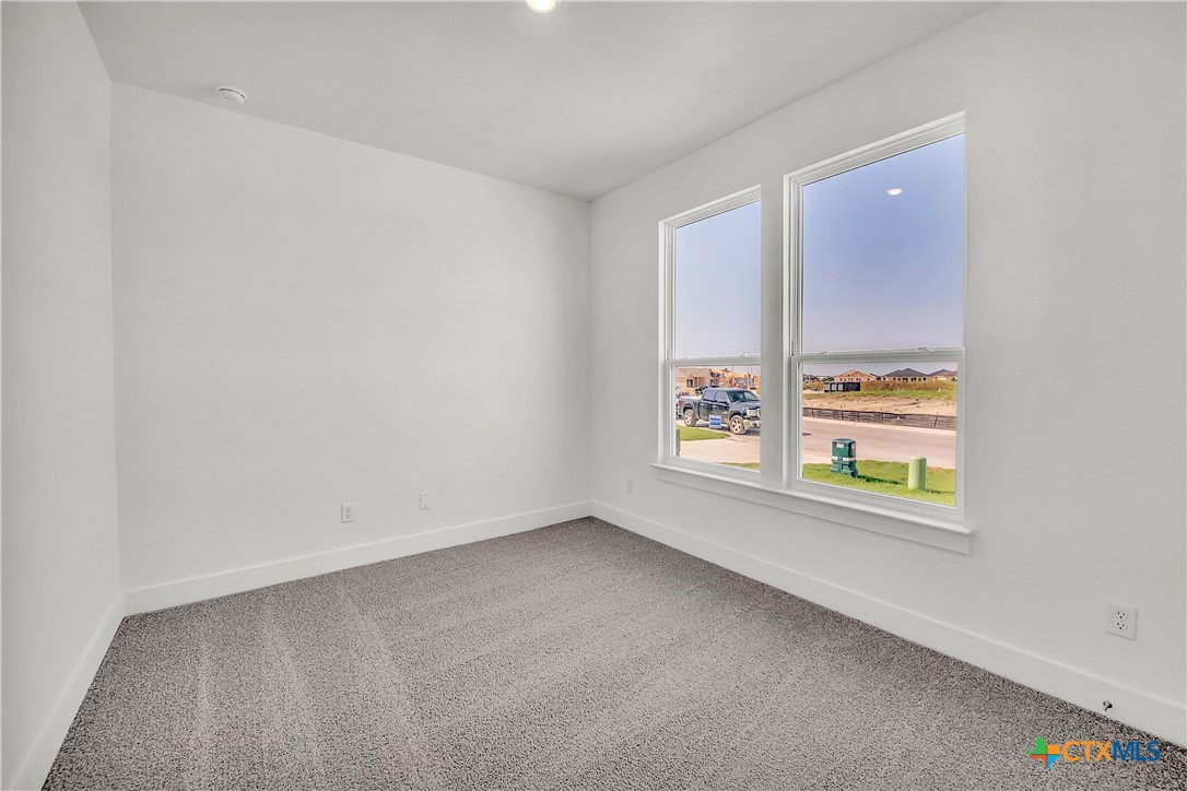1209 Peppermint Drive Temple, TX 76501 - Photo 16 of 17 an empty room with windows