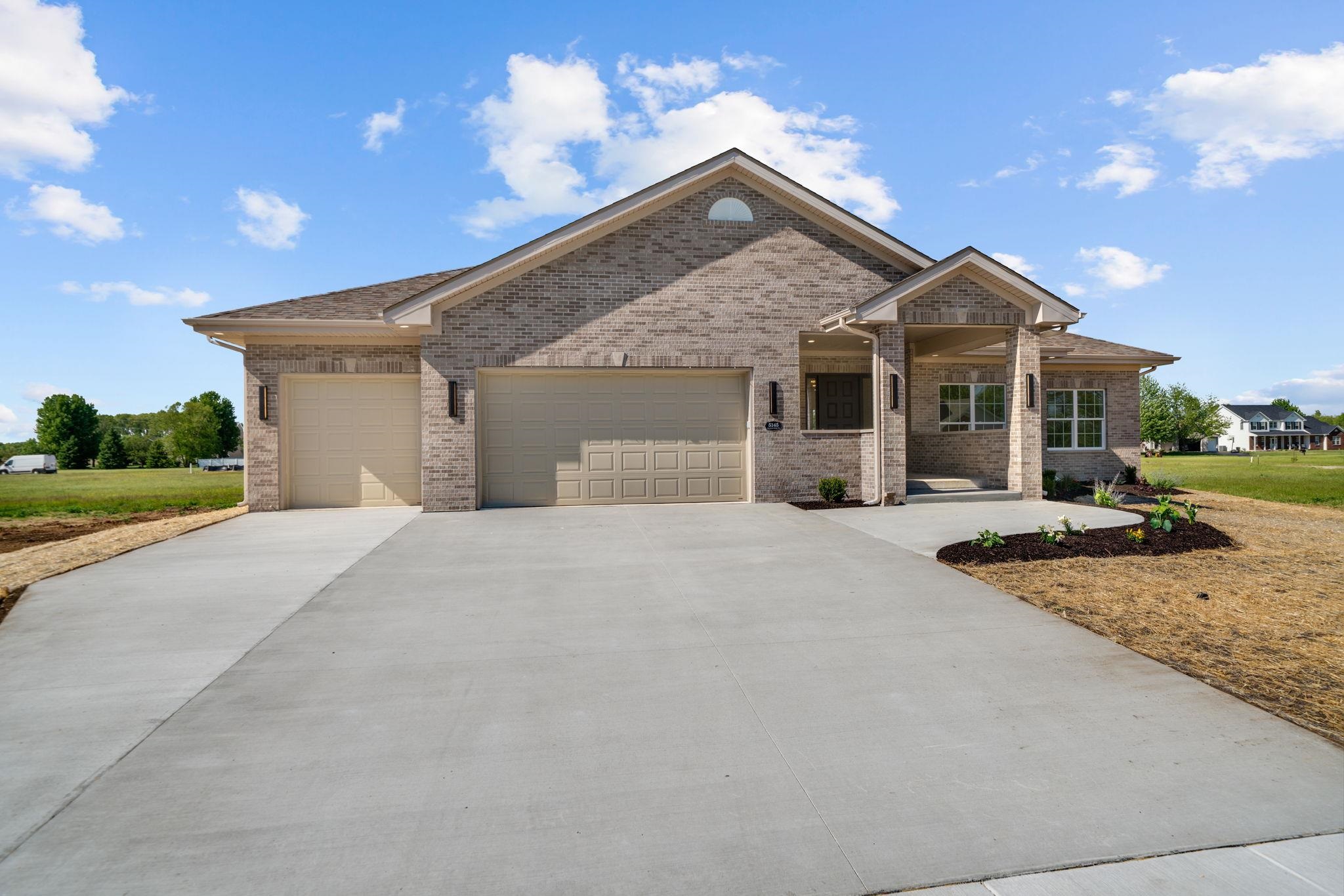 5145 Sycamore Ridge Road Belvidere, IL 61008 - Photo 54 of 57 a front view of a house with a yard and potted plants