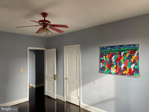 a view of a hallway with a bookshelf