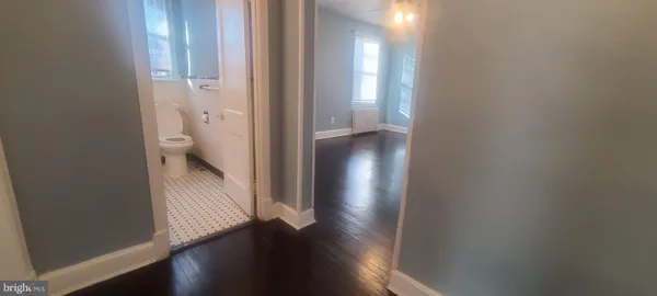 a view of a bathroom from a hallway