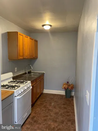a kitchen with a stove and a sink