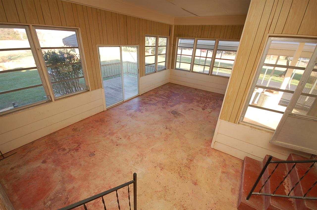 358 Cedar Grove Road Ruckersville, VA 22968 - Photo 14 of 22 a view of an empty room with wooden floor and a window