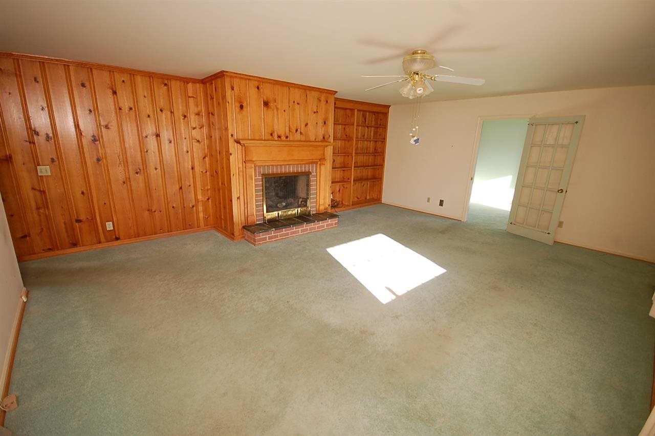 358 Cedar Grove Road Ruckersville, VA 22968 - Photo 2 of 22 an empty room with windows and fireplace