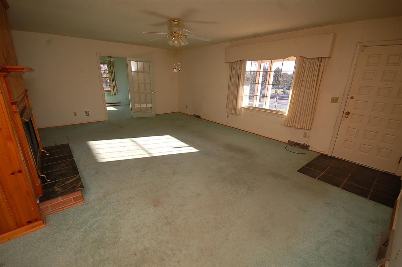 358 Cedar Grove Road Ruckersville, VA 22968 - Photo 3 of 22 wooden floor in an empty room with a window