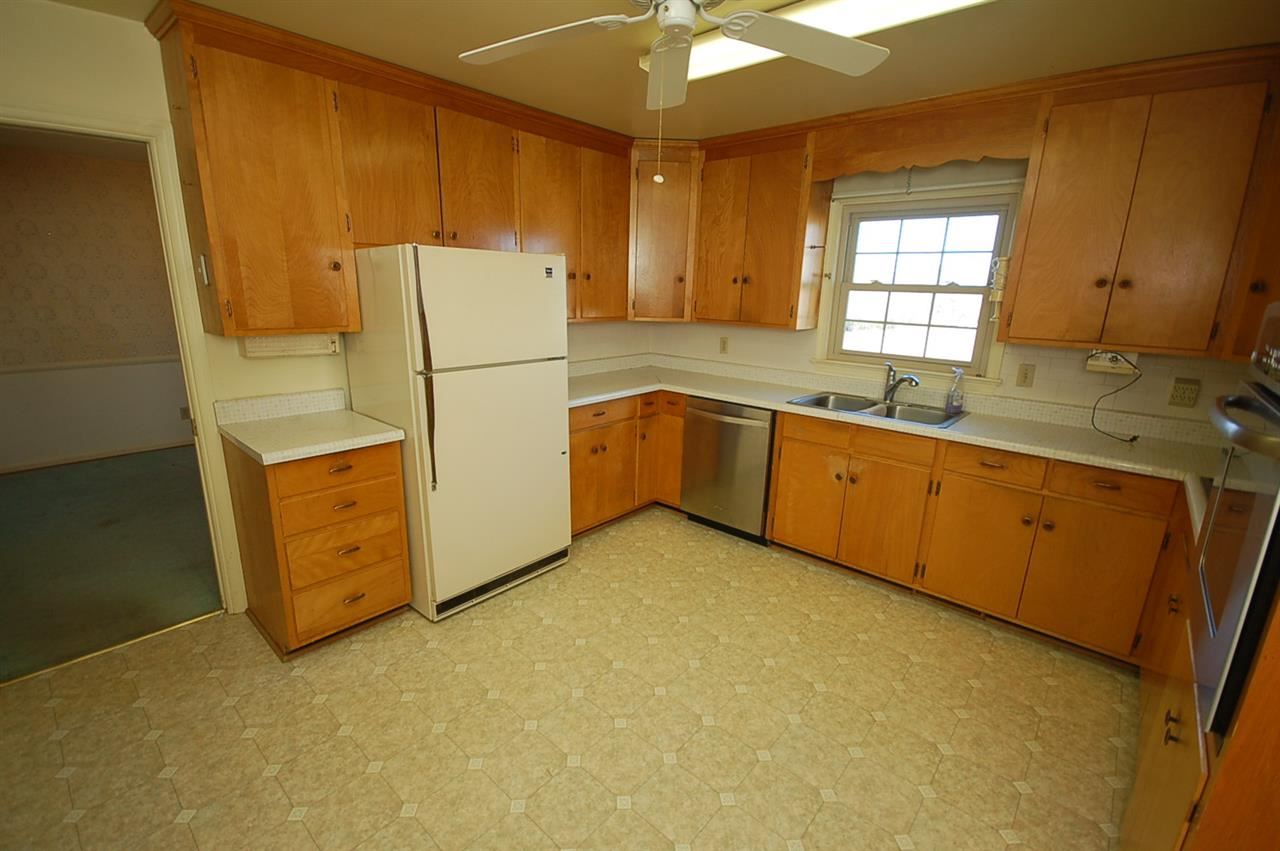 358 Cedar Grove Road Ruckersville, VA 22968 - Photo 6 of 22 a kitchen with a sink a stove a refrigerator and a window
