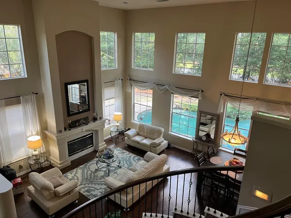 a living room with furniture fireplace and flat screen tv