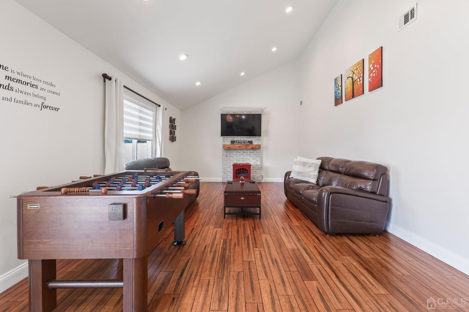 7 Mountbatten Drive Old Bridge, NJ 08857 - Photo 20 of 42 a living room with furniture and a flat screen tv