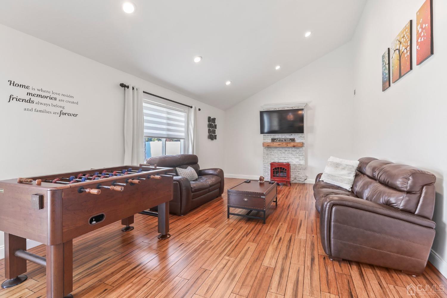 7 Mountbatten Drive Old Bridge, NJ 08857 - Photo 21 of 42 a living room with furniture and a flat screen tv
