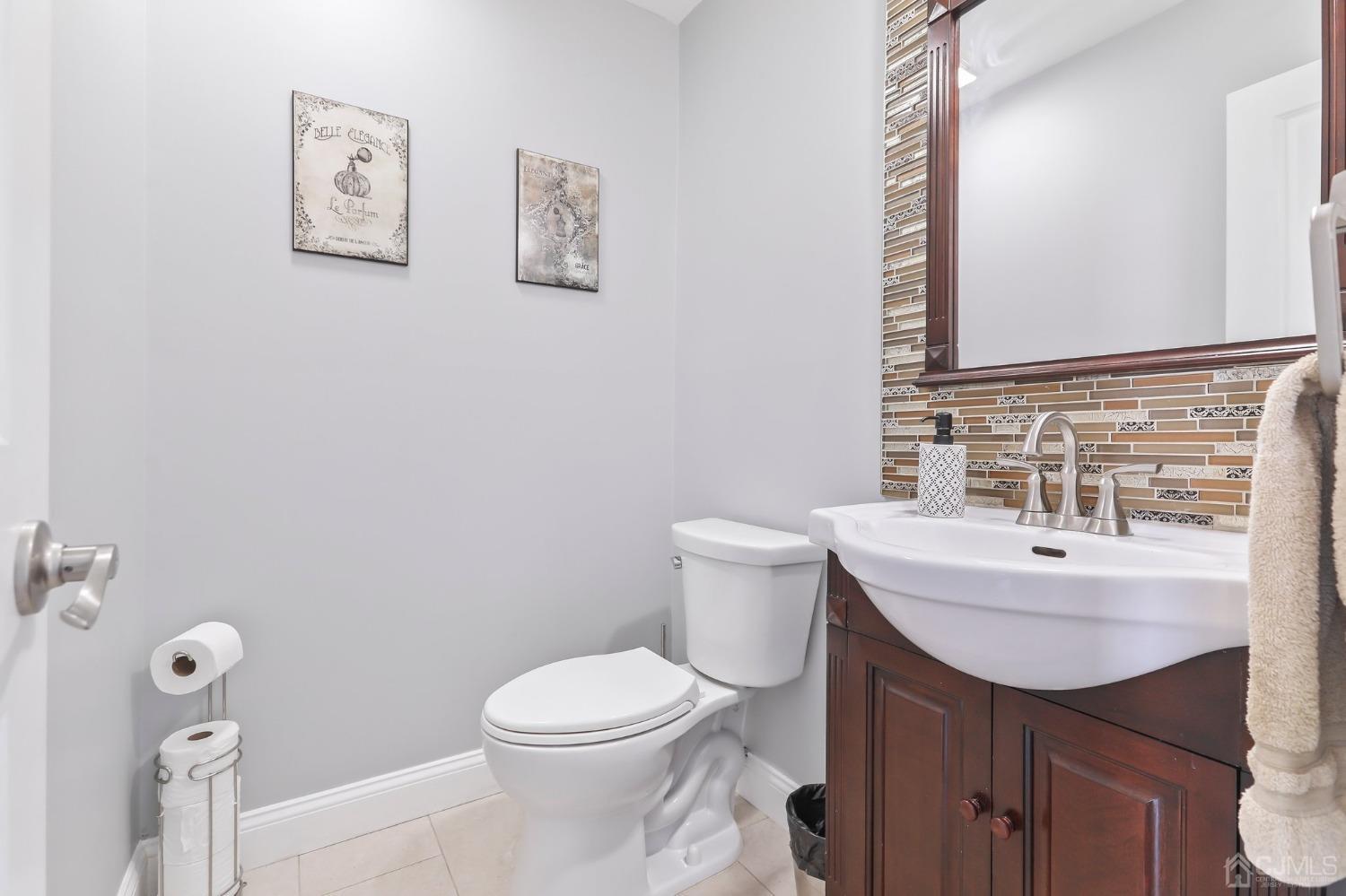 7 Mountbatten Drive Old Bridge, NJ 08857 - Photo 24 of 42 a bathroom with a toilet sink and mirror