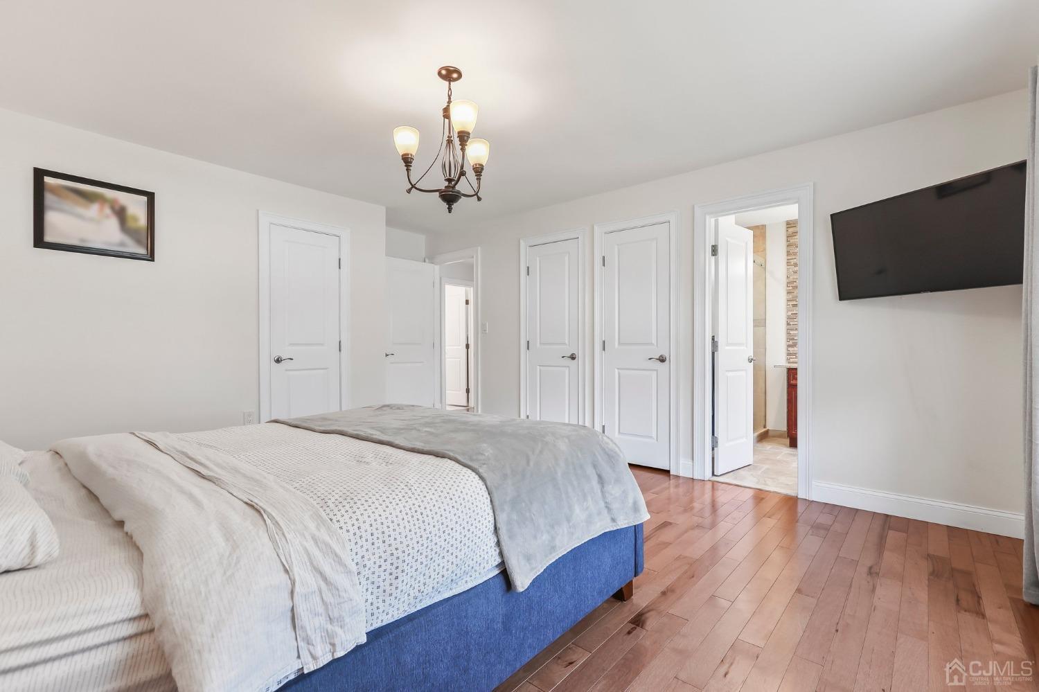 7 Mountbatten Drive Old Bridge, NJ 08857 - Photo 27 of 42 a spacious bedroom with a bed and a flat screen tv