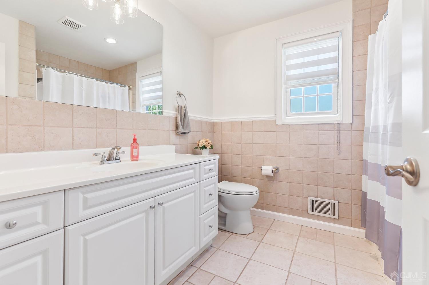 7 Mountbatten Drive Old Bridge, NJ 08857 - Photo 34 of 42 a bathroom with a sink toilet and shower