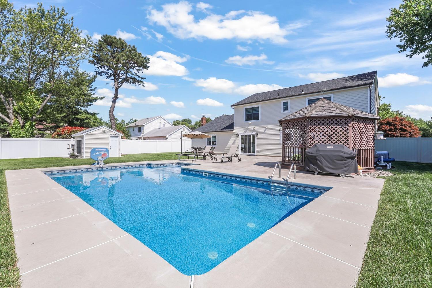 7 Mountbatten Drive Old Bridge, NJ 08857 - Photo 37 of 42 a view of a house with swimming pool and sitting area