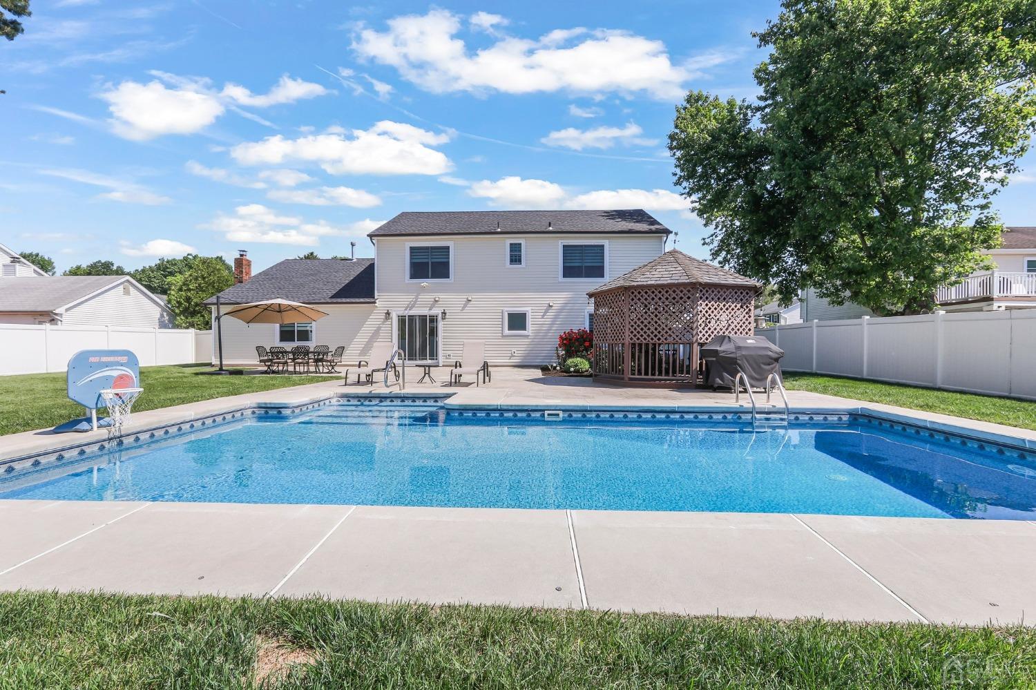 7 Mountbatten Drive Old Bridge, NJ 08857 - Photo 38 of 42 a swimming pool with outdoor seating and yard