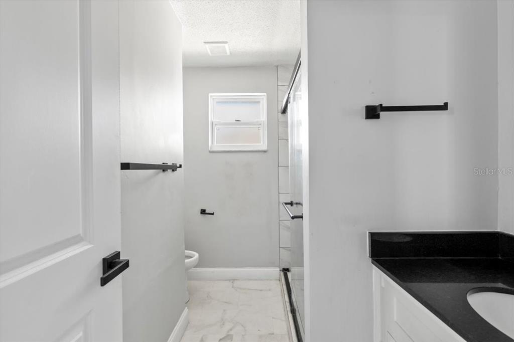 1436 Mardrake Road Daytona Beach, FL 32114 - Photo 15 of 37 a bathroom with a shower