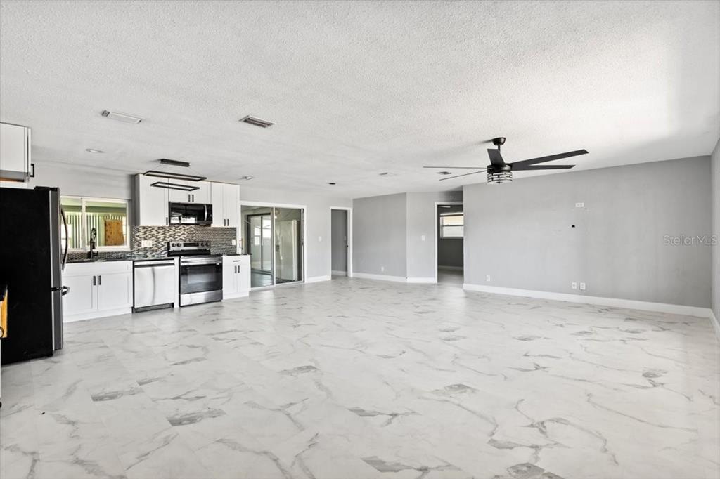 1436 Mardrake Road Daytona Beach, FL 32114 - Photo 2 of 37 a view of a kitchen with a sink