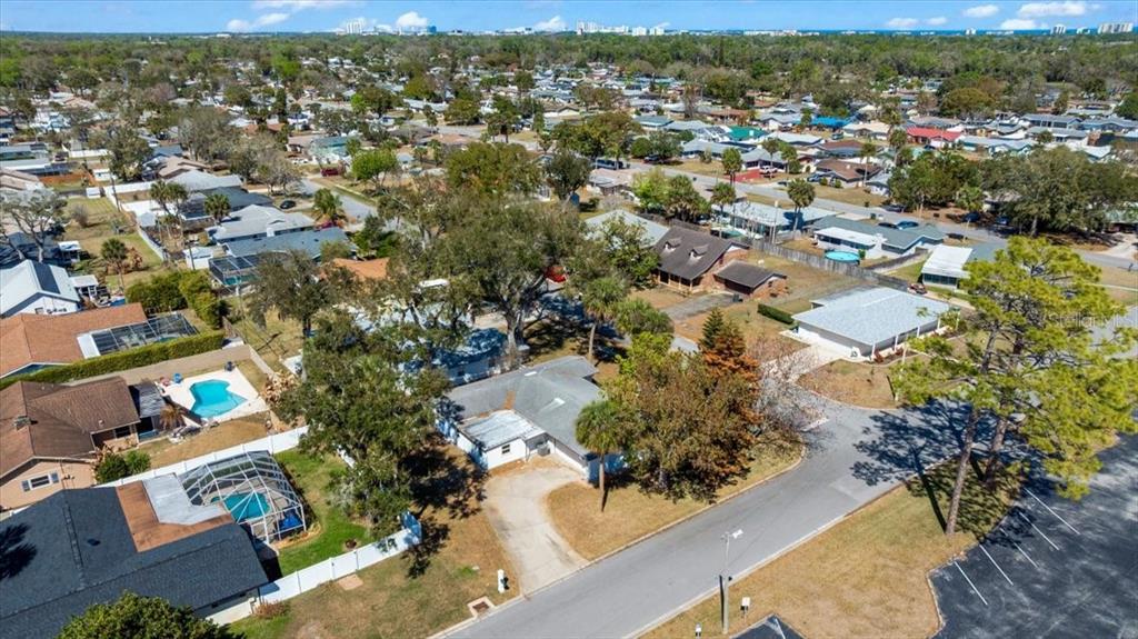 1436 Mardrake Road Daytona Beach, FL 32114 - Photo 27 of 37 an aerial view of residential houses with outdoor space and trees