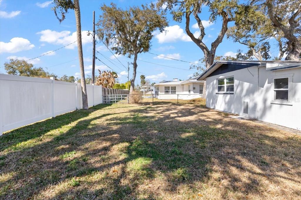 1436 Mardrake Road Daytona Beach, FL 32114 - Photo 32 of 37 a front view of a house with a yard and fountain