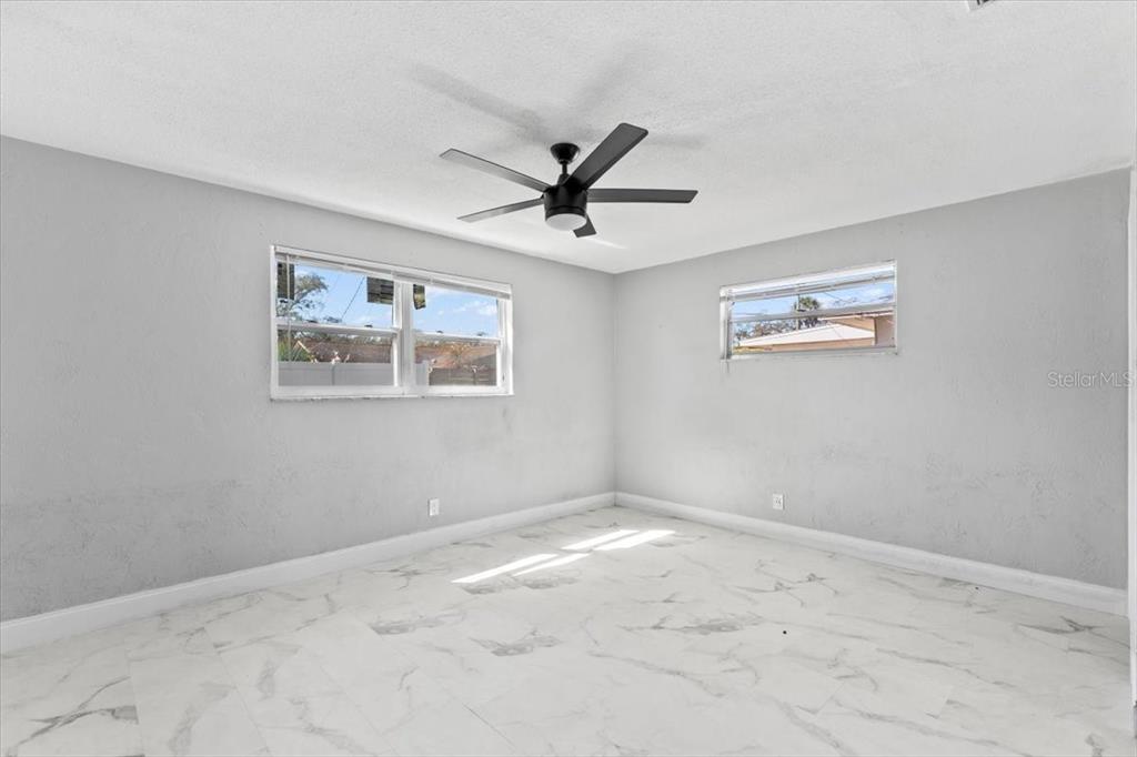 1436 Mardrake Road Daytona Beach, FL 32114 - Photo 8 of 37 a view of a livingroom with a ceiling fan and window