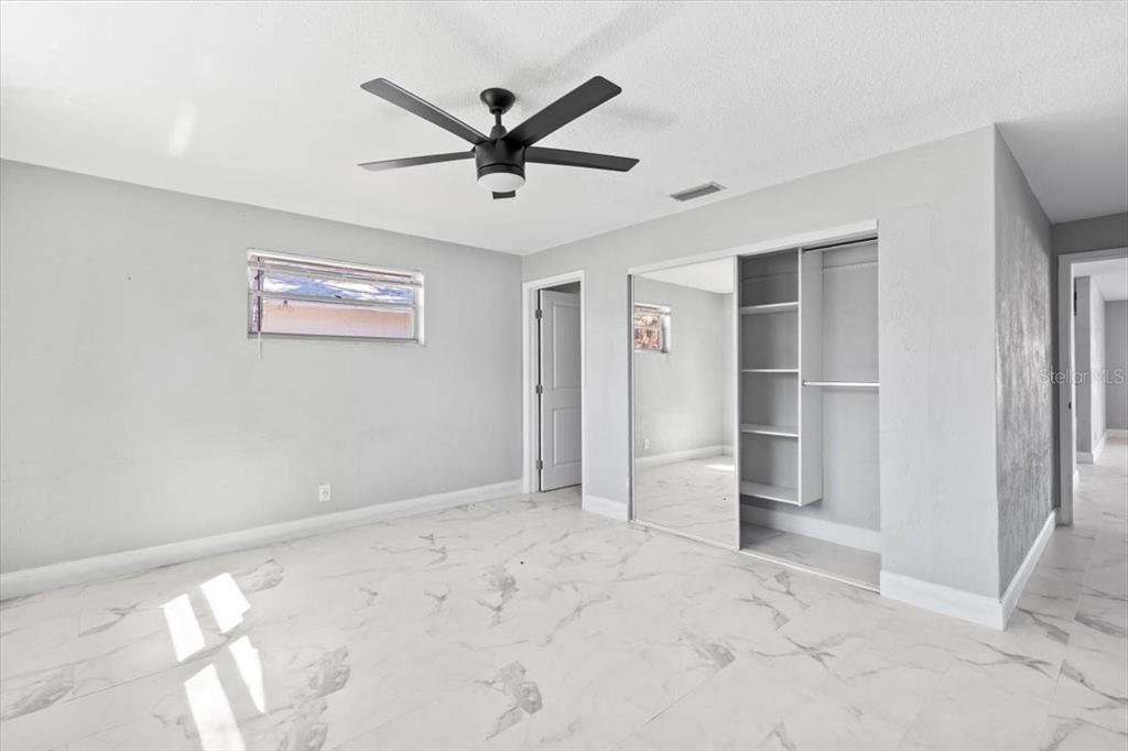 1436 Mardrake Road Daytona Beach, FL 32114 - Photo 9 of 37 a view of a livingroom with a ceiling fan