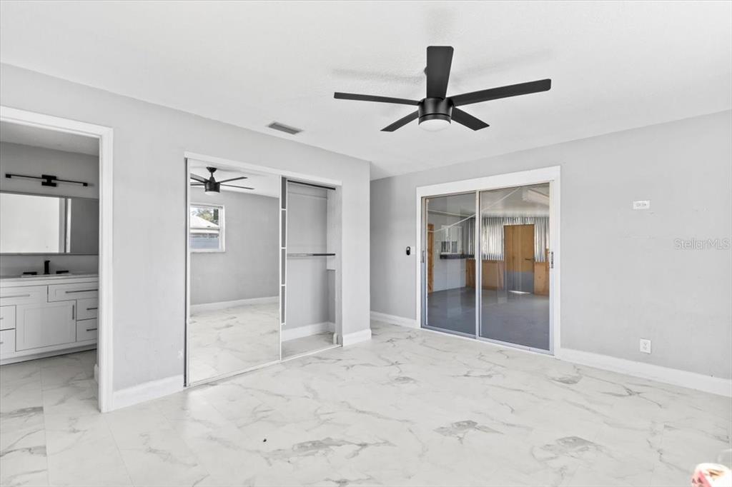 1436 Mardrake Road Daytona Beach, FL 32114 - Photo 10 of 37 a view of a hallway to closet and a living room