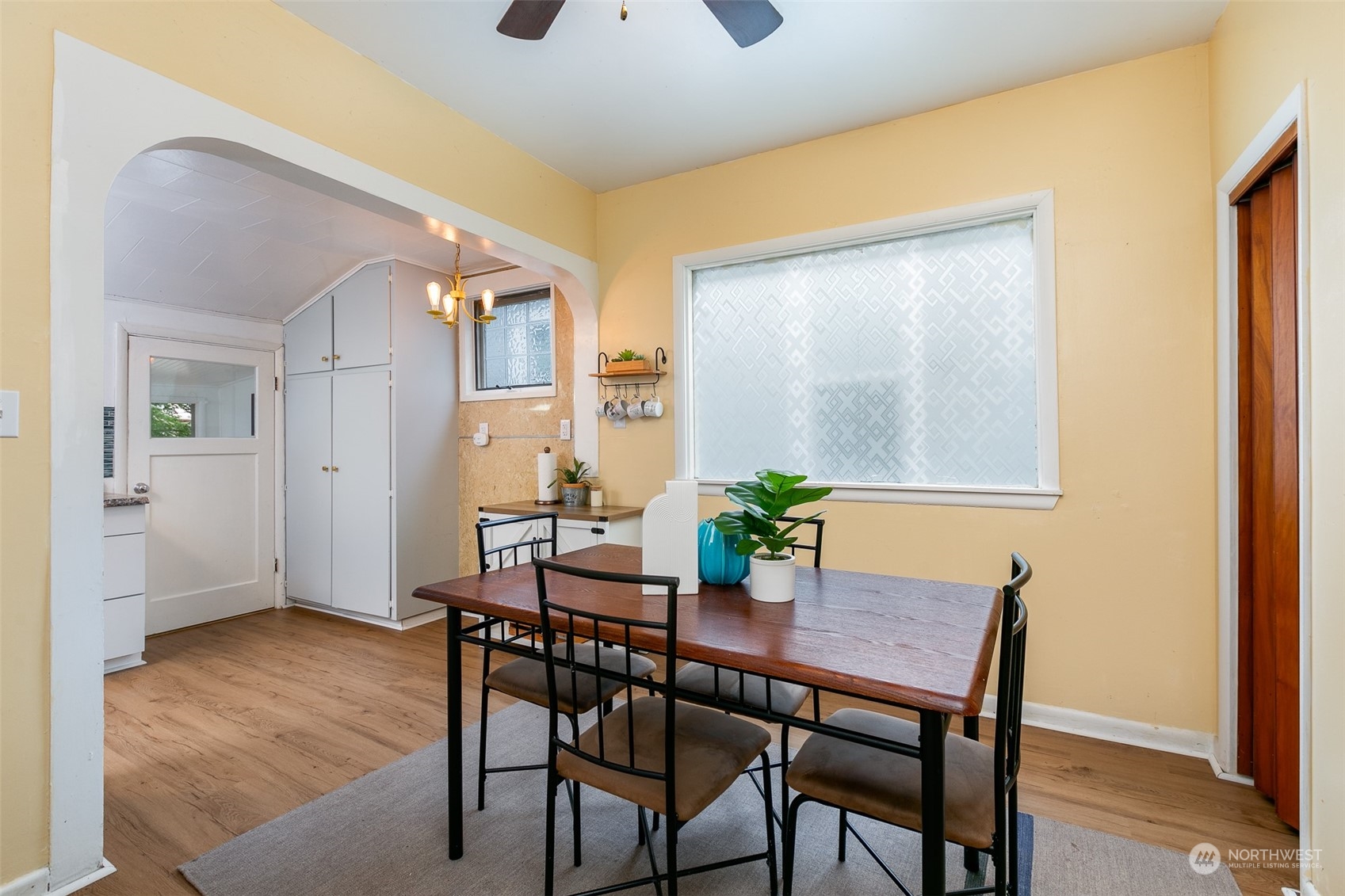 3408 Rockefeller Avenue Everett, WA 98201 - Photo 12 of 36 a view of a dining room with furniture and wooden floor