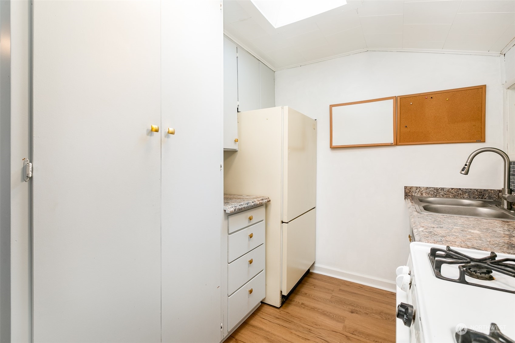 3408 Rockefeller Avenue Everett, WA 98201 - Photo 13 of 36 a kitchen with a refrigerator and cabinets