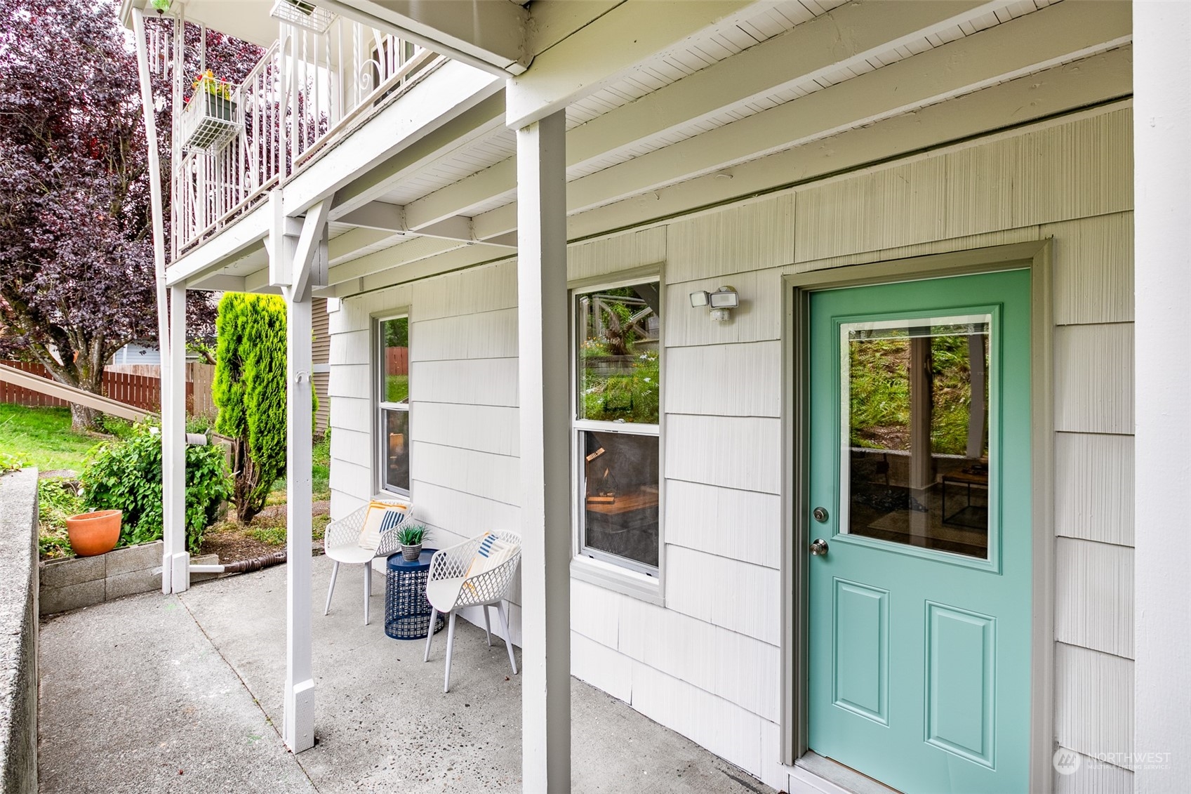 3408 Rockefeller Avenue Everett, WA 98201 - Photo 16 of 36 a view of a porch with a potted plant and a large window