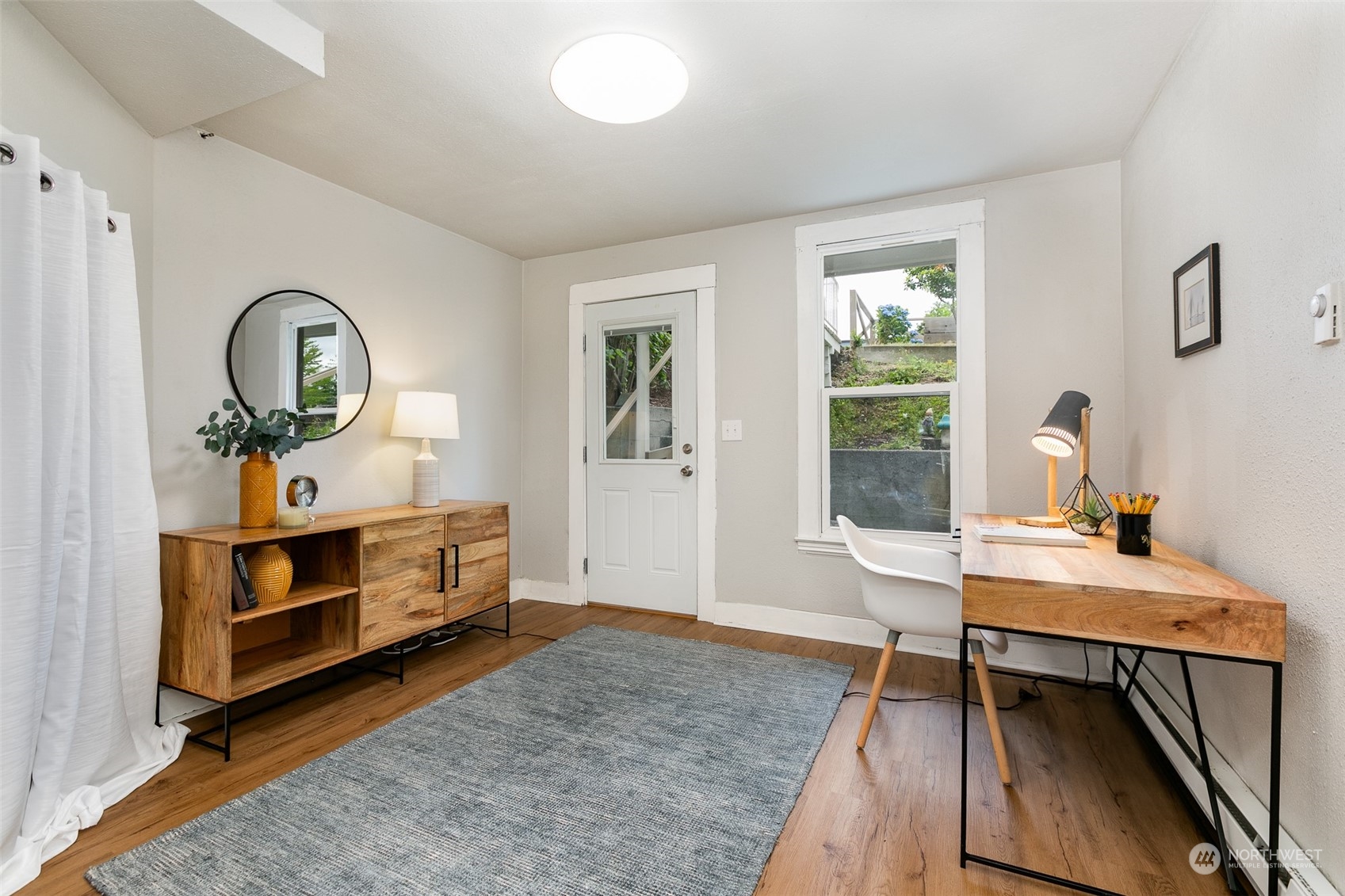 3408 Rockefeller Avenue Everett, WA 98201 - Photo 17 of 36 a view of a workspace with furniture and a window