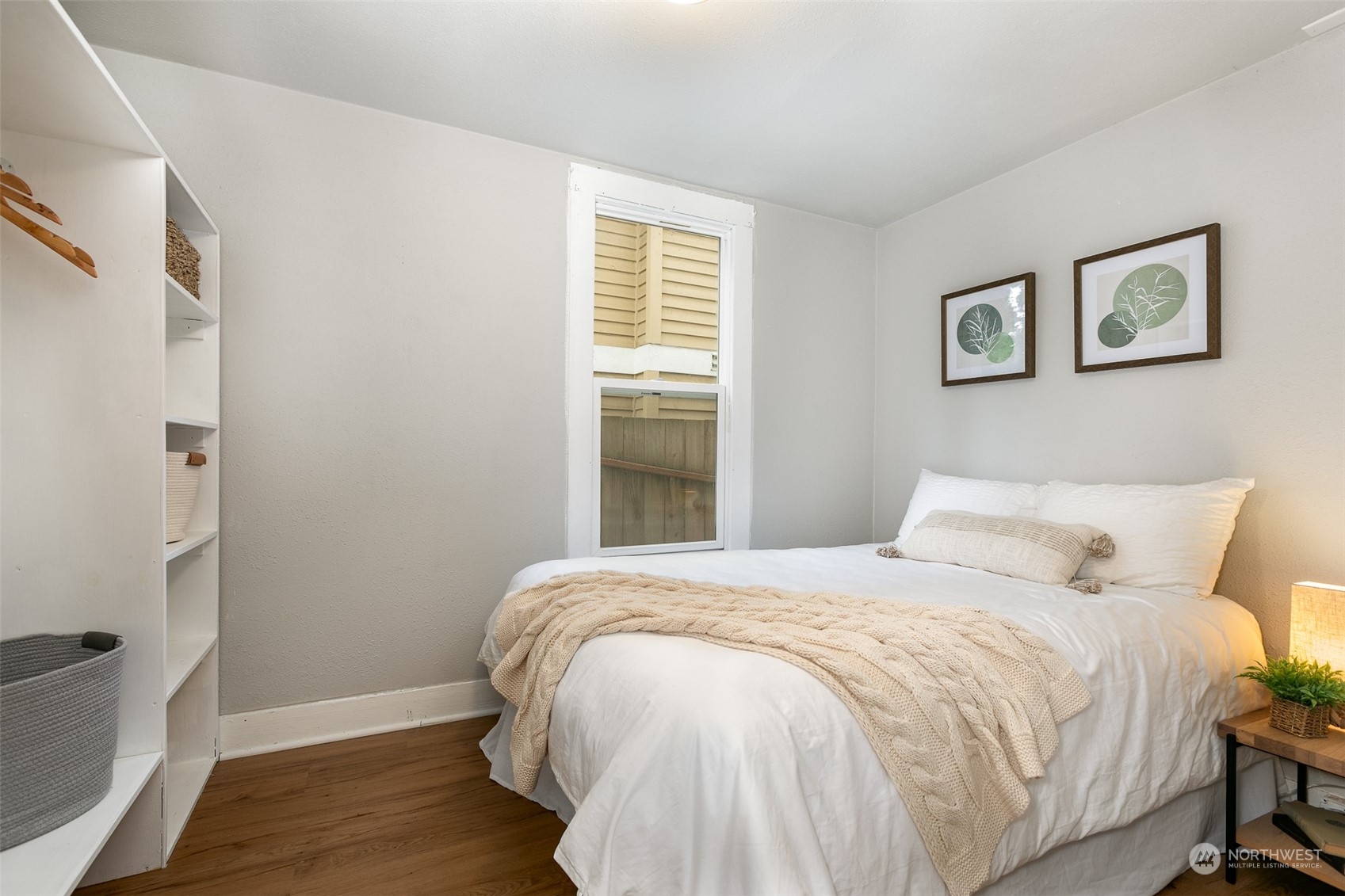 3408 Rockefeller Avenue Everett, WA 98201 - Photo 22 of 36 a bedroom with a bed and wooden floor