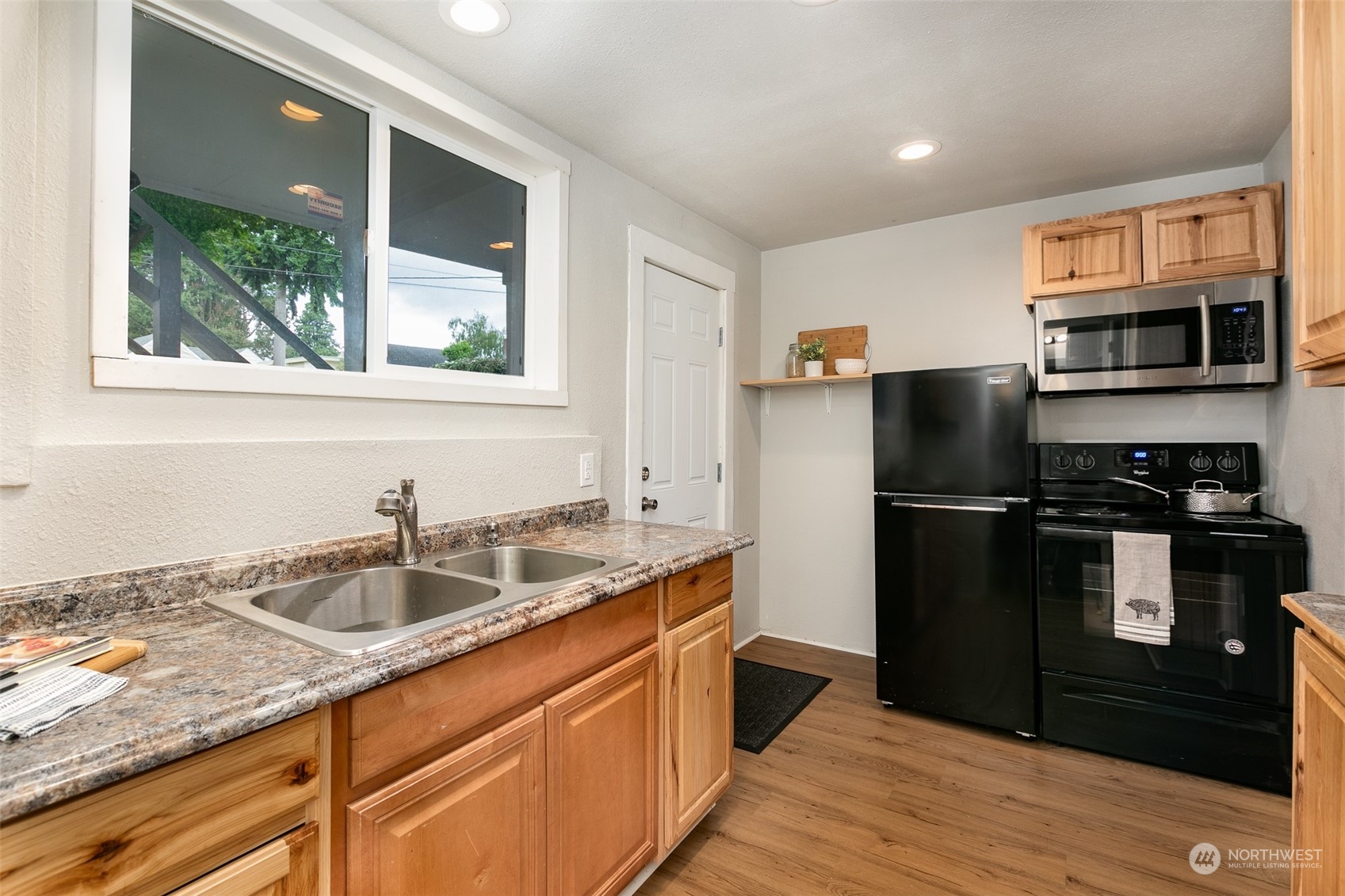 3408 Rockefeller Avenue Everett, WA 98201 - Photo 27 of 36 a kitchen with a refrigerator and a sink
