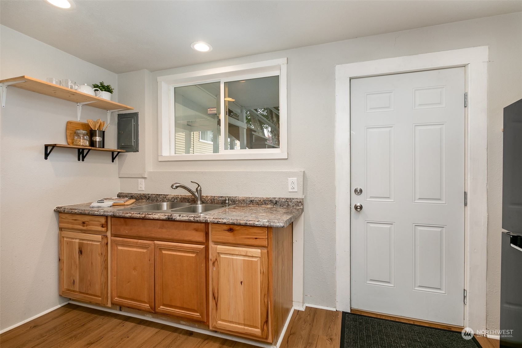 3408 Rockefeller Avenue Everett, WA 98201 - Photo 28 of 36 a bathroom with a granite countertop sink and a mirror