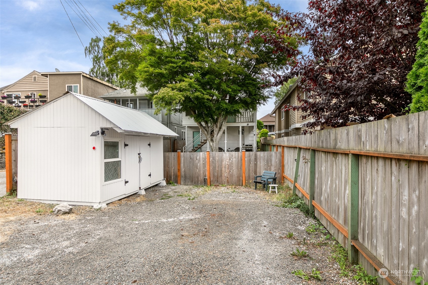 3408 Rockefeller Avenue Everett, WA 98201 - Photo 33 of 36 a view of backyard with small cabin and wooden fence