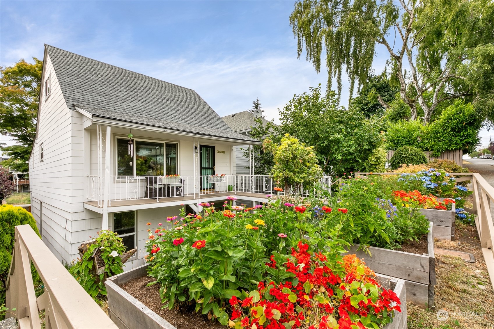 3408 Rockefeller Avenue Everett, WA 98201 - Photo 35 of 36 a front view of a house with a yard and fountain