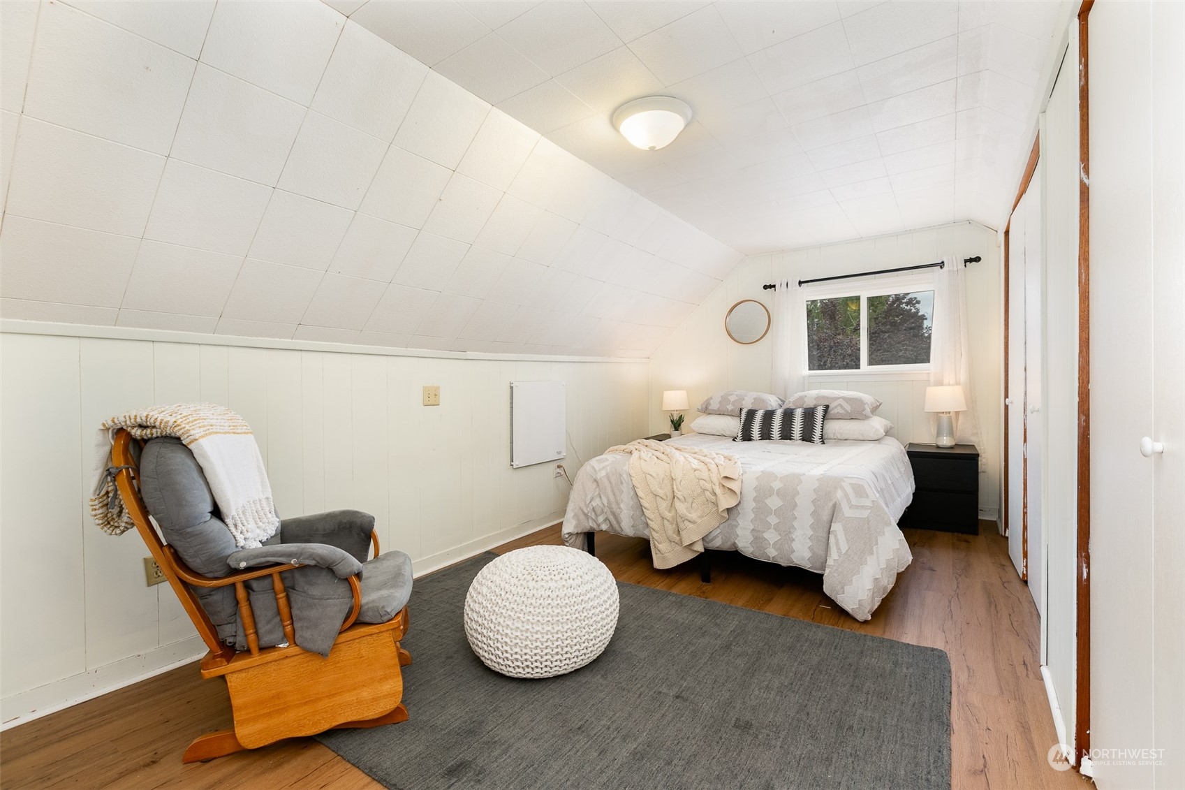 3408 Rockefeller Avenue Everett, WA 98201 - Photo 5 of 36 a bedroom with bed and chair