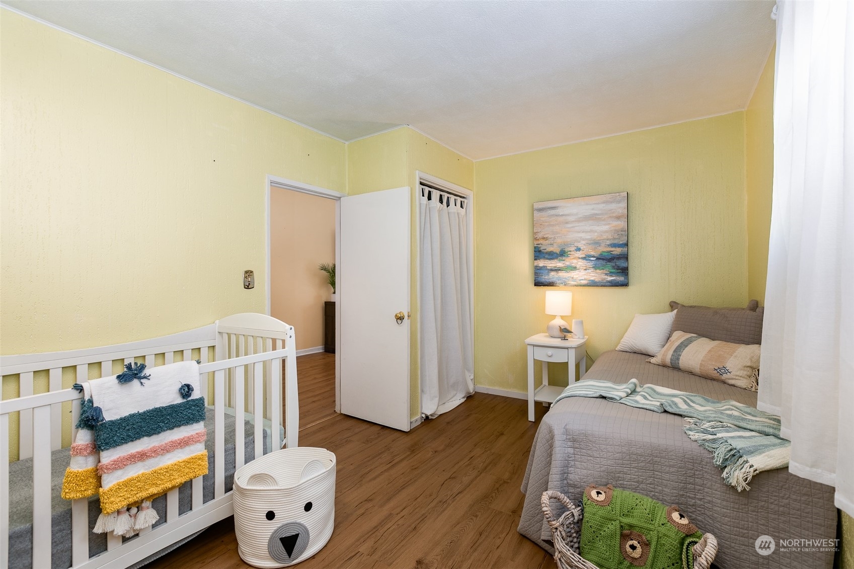 3408 Rockefeller Avenue Everett, WA 98201 - Photo 10 of 36 a bedroom with a bed and wooden floor
