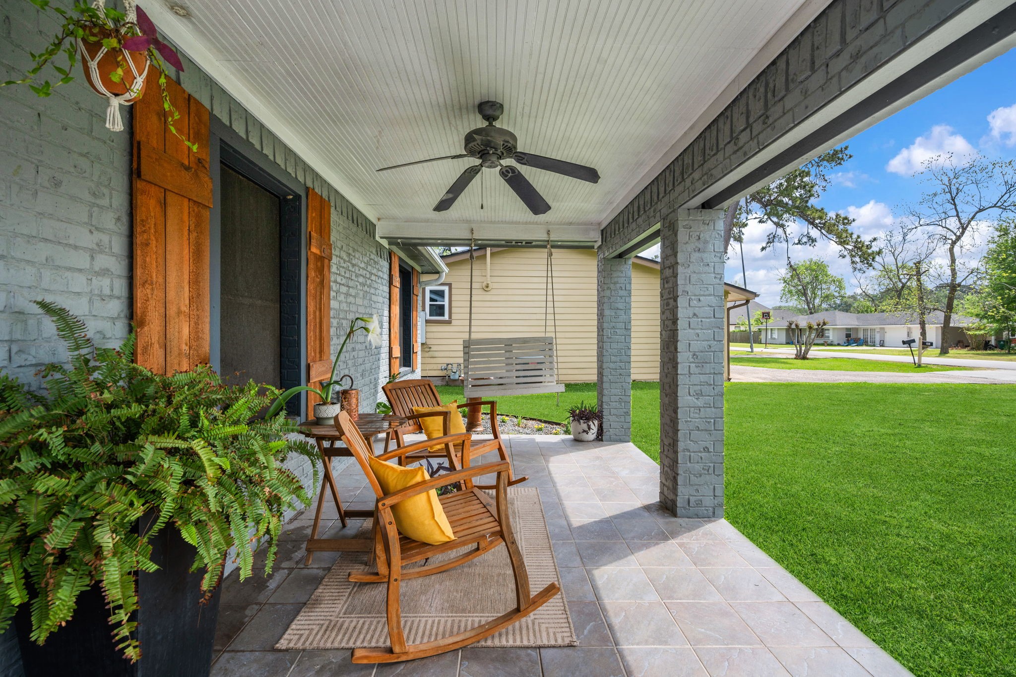 431 Corydon Drive Houston, TX 77336 - Photo 3 of 26 The covered front porch is designed for comfort, featuring a classic beadboard ceiling and ceiling fan that elevate the space. This inviting retreat is perfect for relaxing with morning coffee while enjoying the peaceful surroundings.