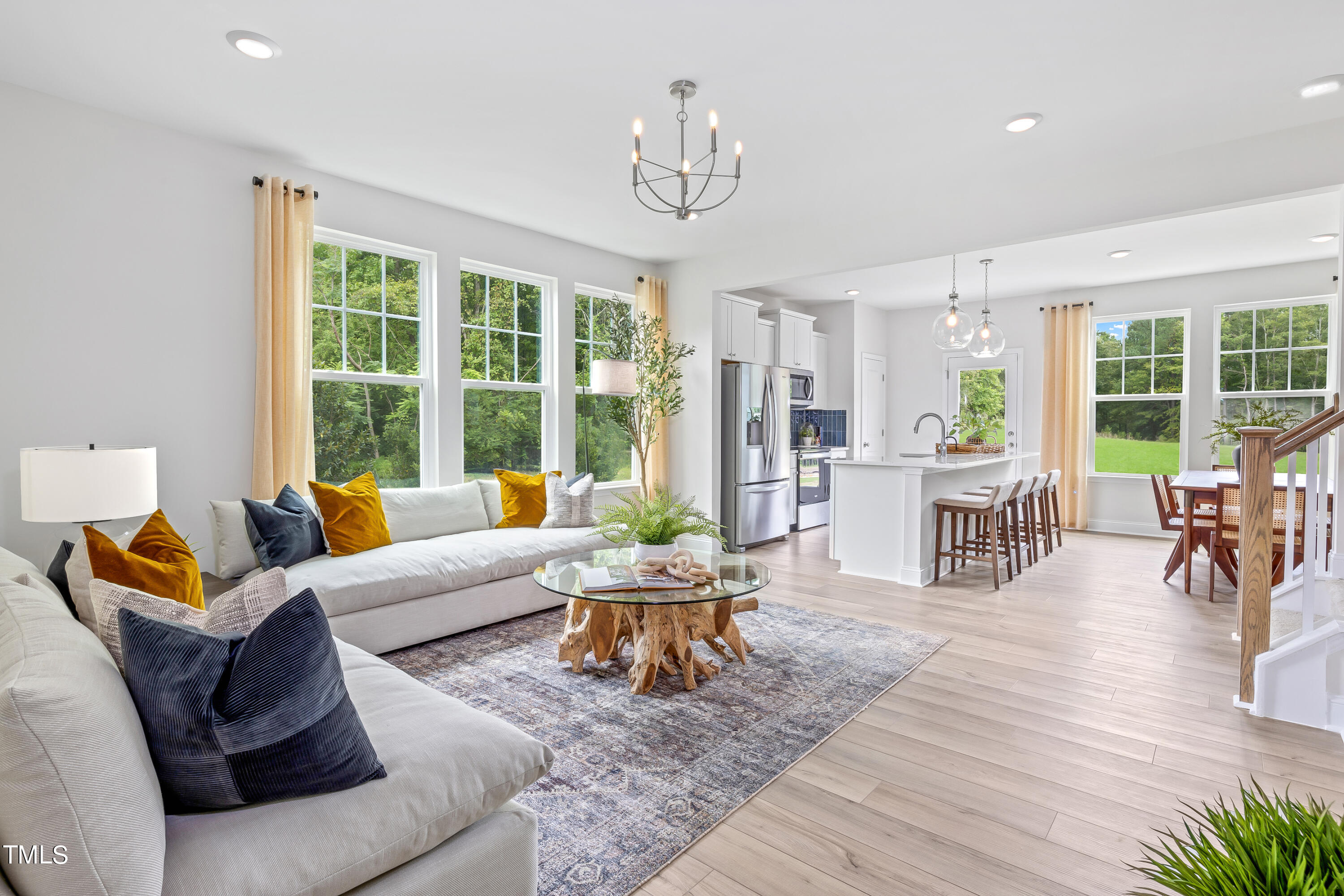 4910 Caddis Bend Raleigh, NC 27604 - Photo 23 of 30 a living room with furniture and wooden floor