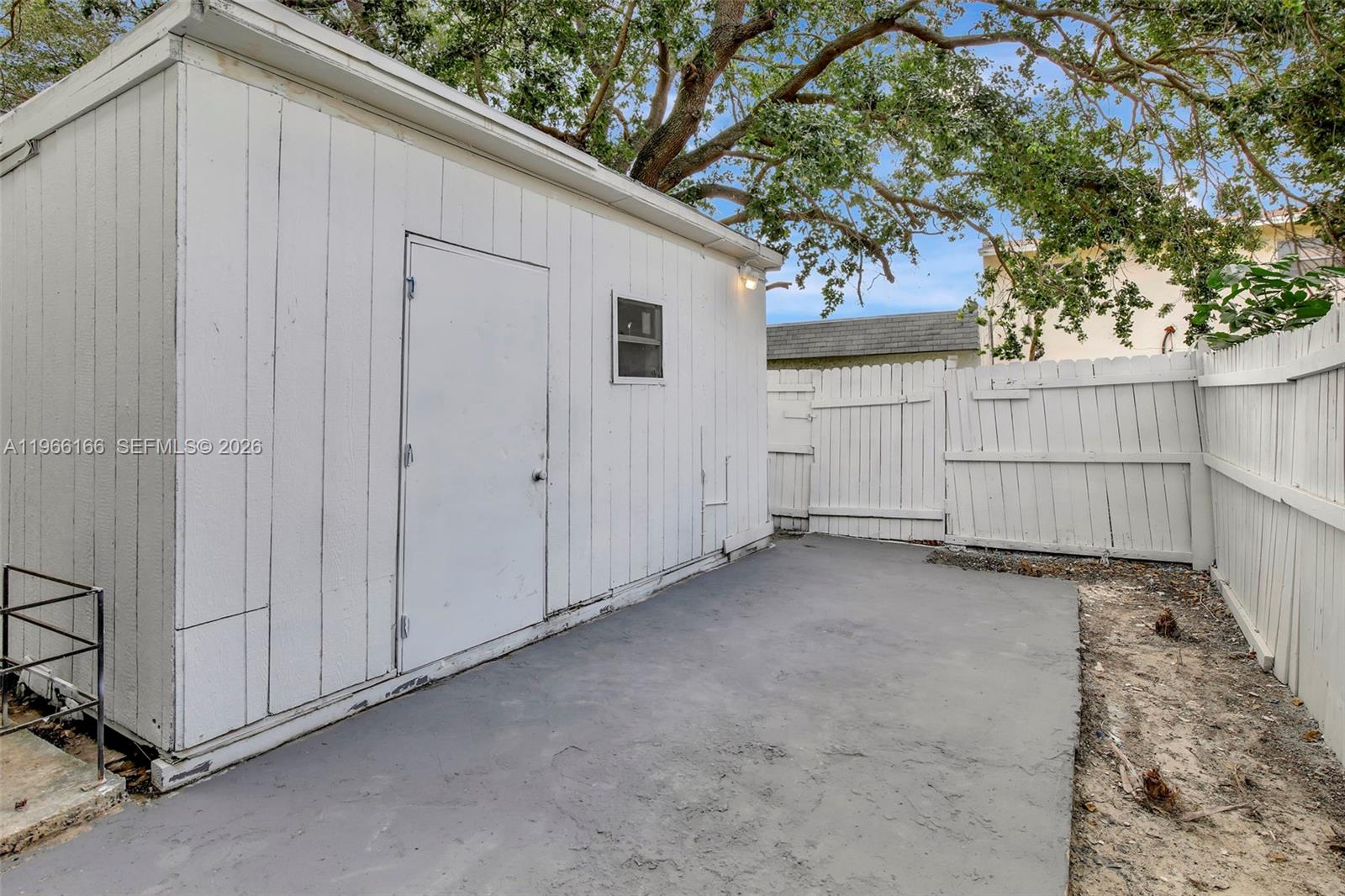 3916 Northwest 207 St Road Miami Gardens, FL 33055 - Photo 36 of 38 a view of a house with a backyard and a garage
