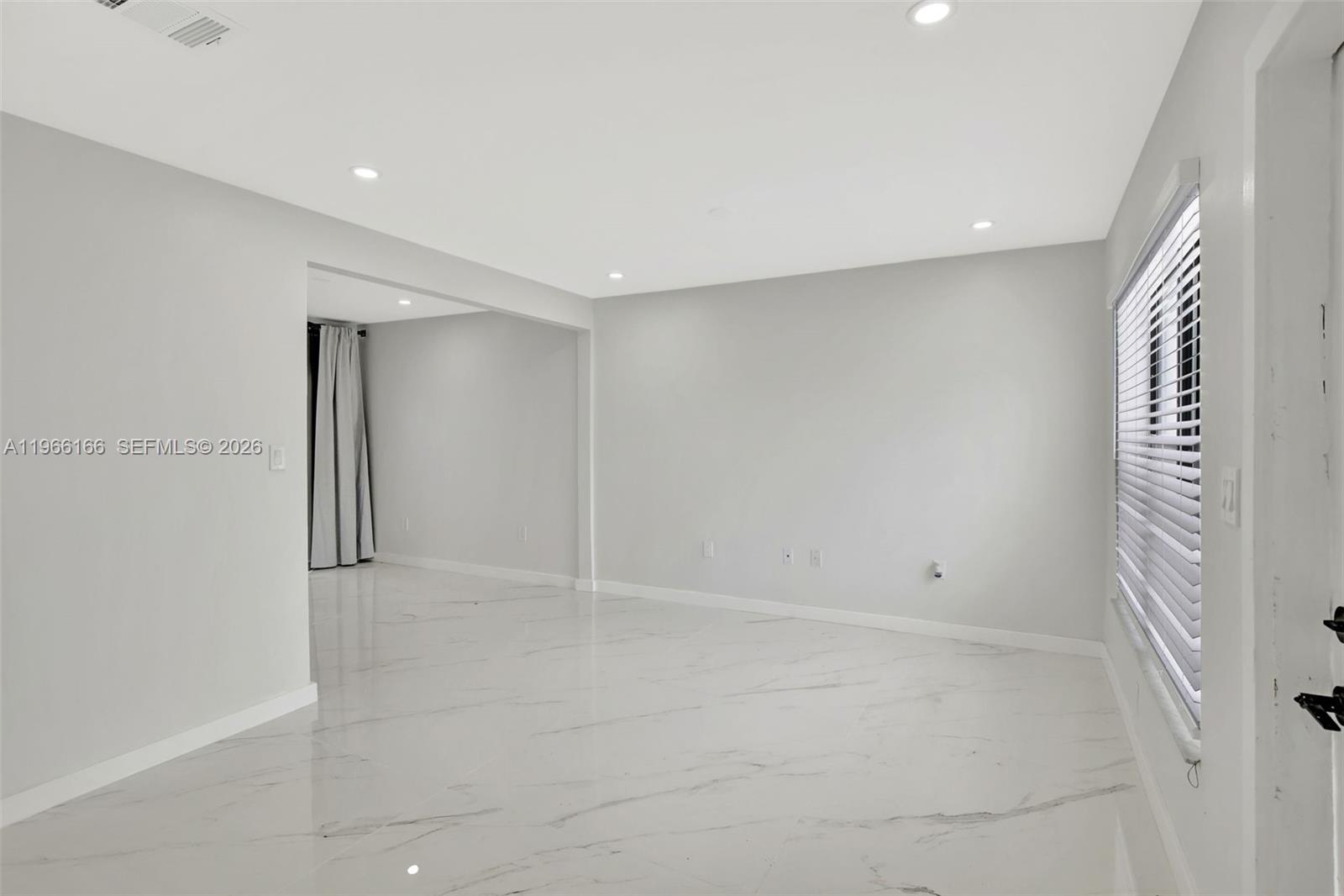 3916 Northwest 207 St Road Miami Gardens, FL 33055 - Photo 9 of 38 wooden floor in an empty room