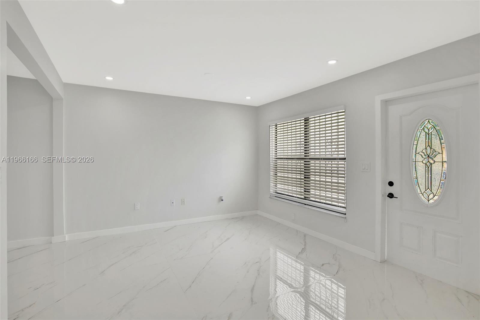 3916 Northwest 207 St Road Miami Gardens, FL 33055 - Photo 10 of 38 a view of an empty room with a window